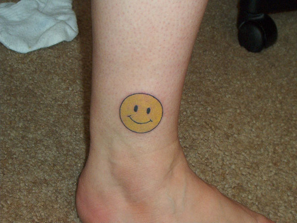 Bold Smiley face by the homegirl Ice  Smiley face tattoo Small tattoos Face  tattoo